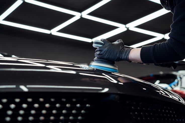 Close-up of a mechanic's hands expertly handling tools during a car repair.