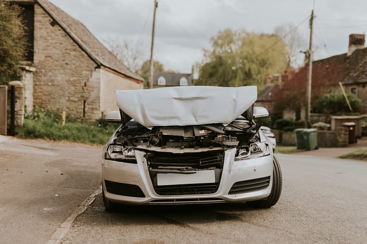 A wrecked car abandoned on the street after a collision in Atlanta.